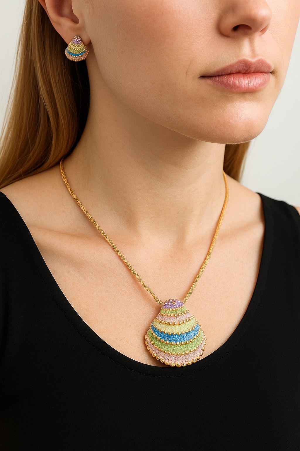 Geometric enamel stud earrings in KC gold plating worn by model