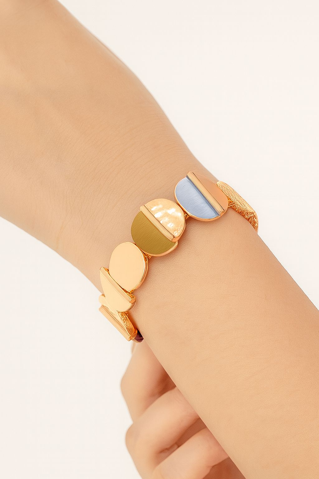 Close-up handmade enamel half-moon bracelet with artistic finish