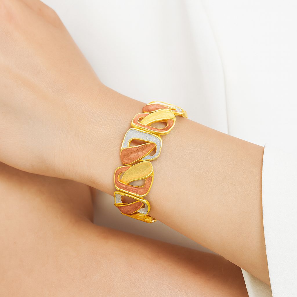 Woman wearing KC gold geometric link bracelet – artistic fashion jewelry