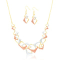 Model wearing geometric gold plated necklace and earrings set