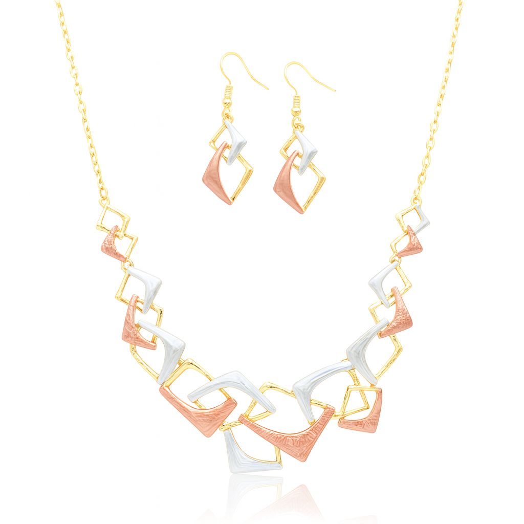 Model wearing geometric gold plated necklace and earrings set