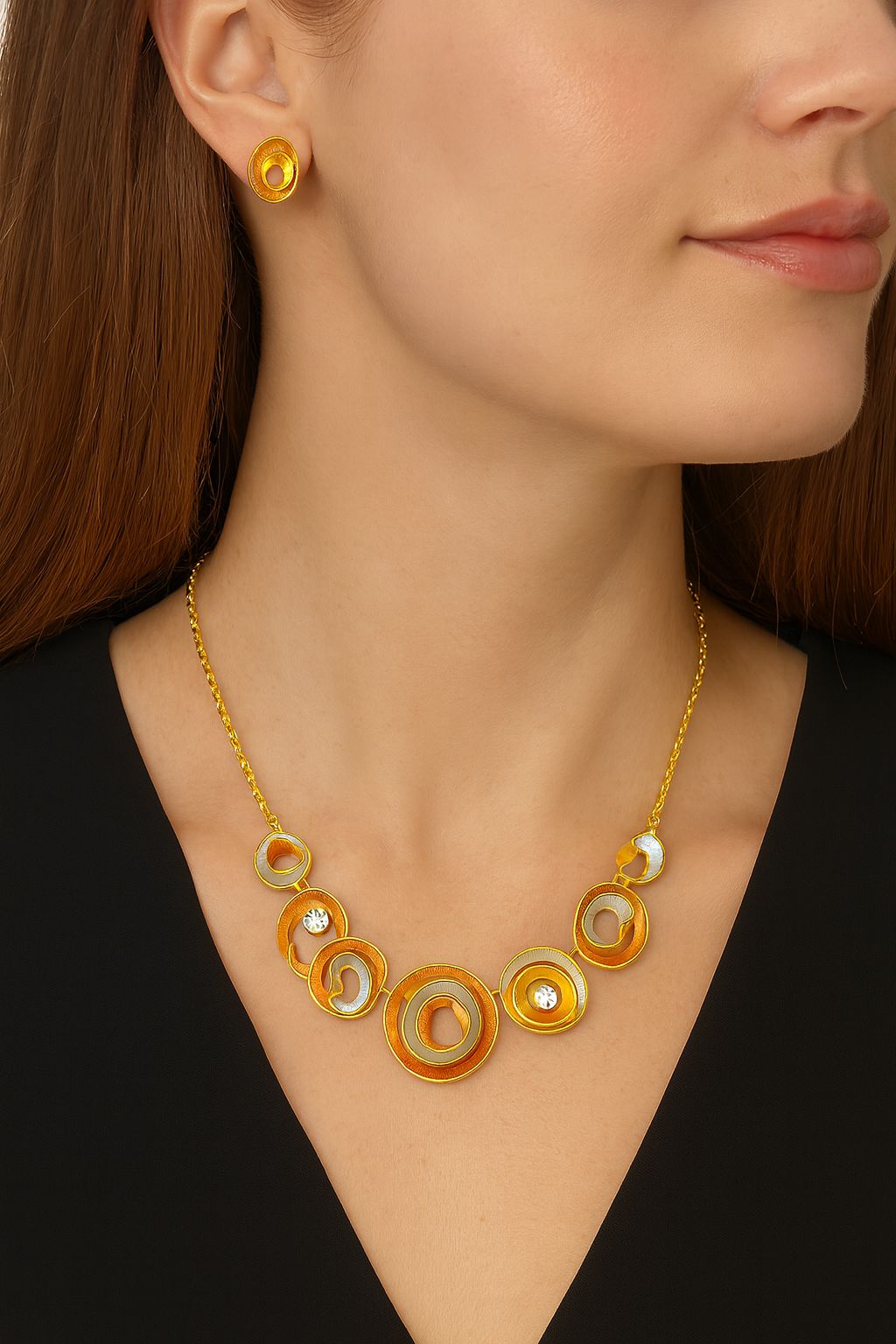 Model wearing artistic hand-painted circle necklace and earrings
