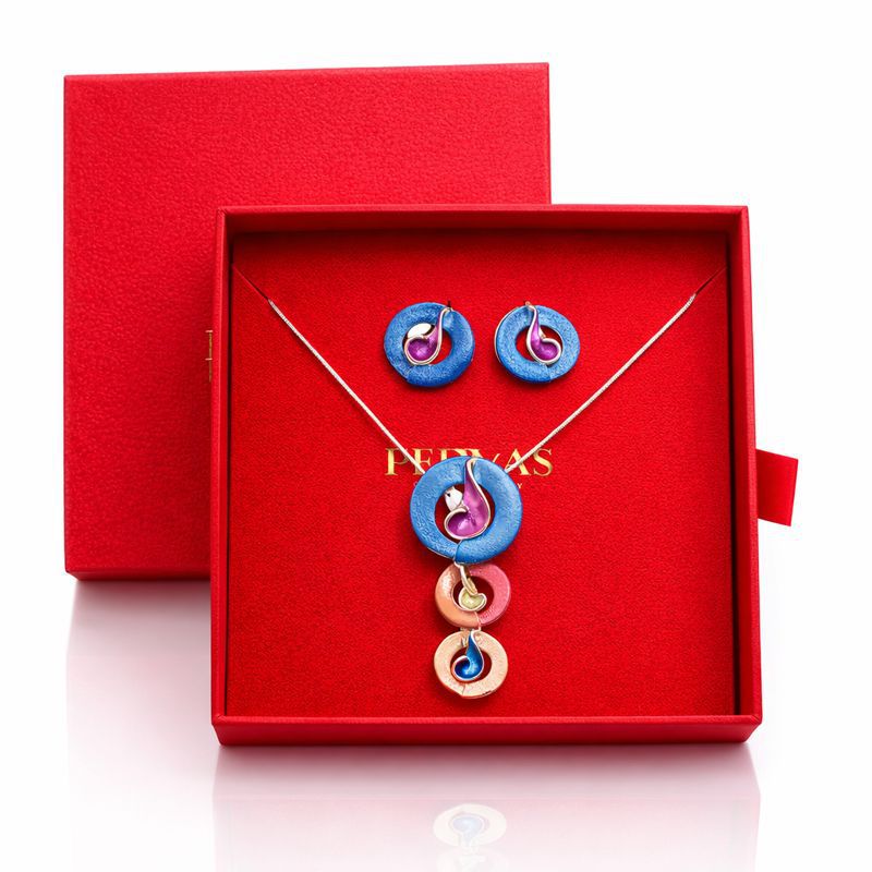 Artistic enamel necklace and earrings worn by model
