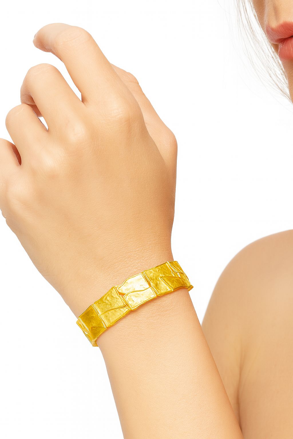Model wearing gold plated artistic enamel bracelet