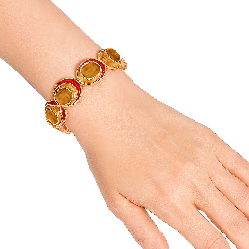 Model wearing colorful enamel gold bracelet cuff
