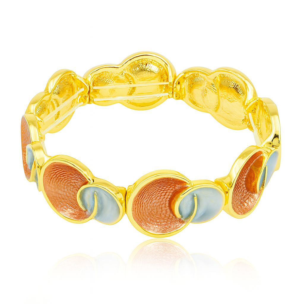 Close-up of handcrafted enamel detailing on gold bracelet for women