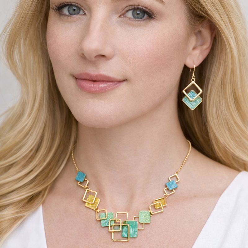 Hand painted enamel necklace and earrings set worn by model