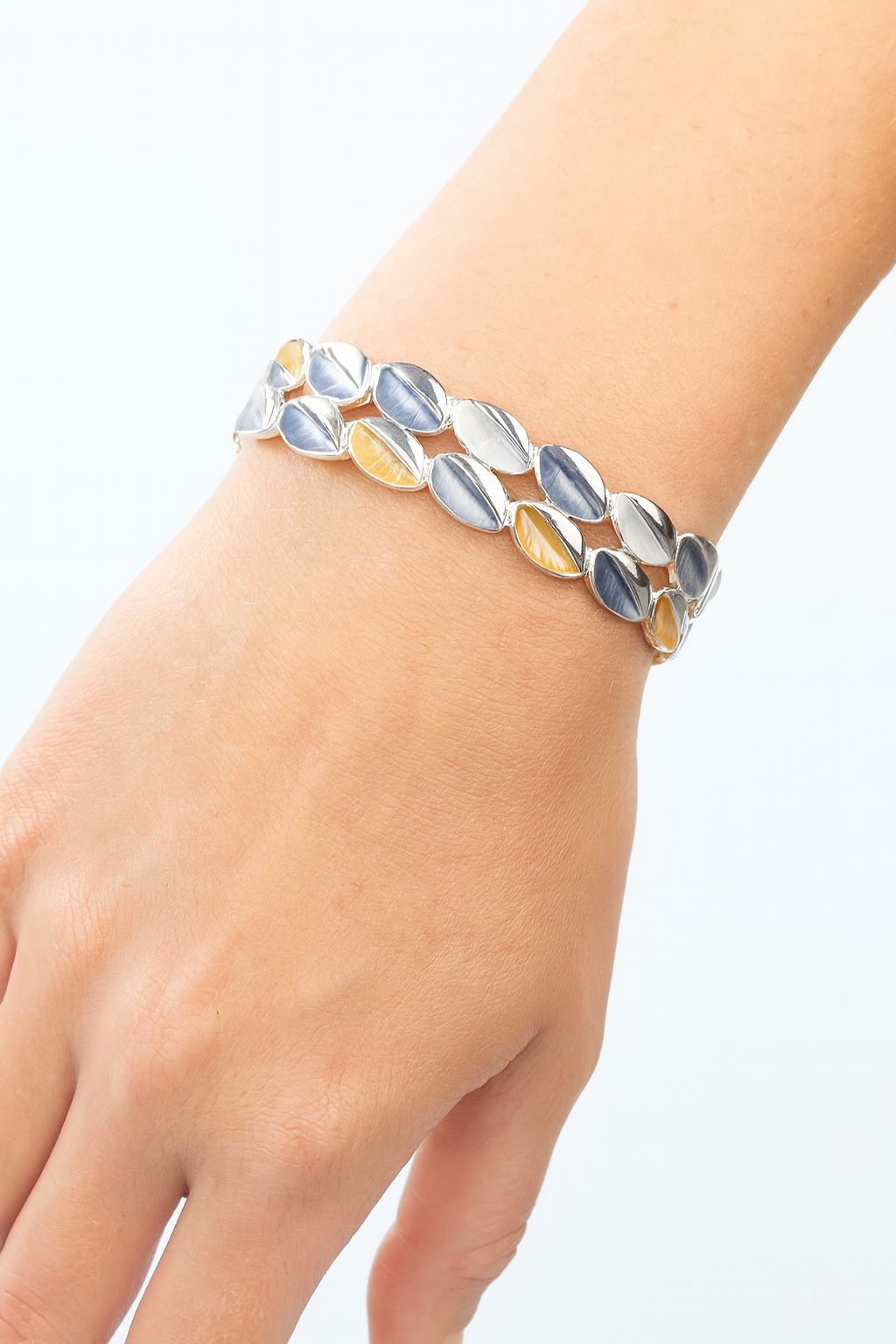 Women’s pastel enamel bracelet with KC gold plating – lifestyle view