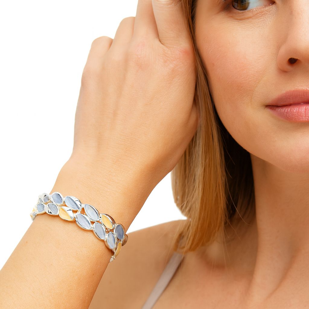 Model wearing gold enamel artistic bracelet – fashion jewelry