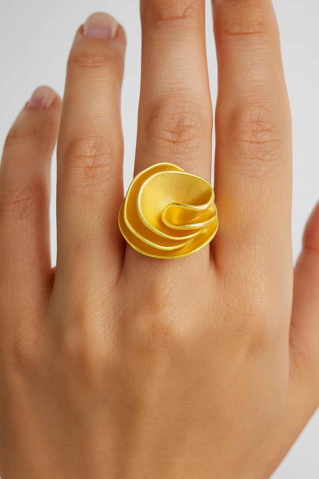 “Close-up of bold enamel gold ring for women