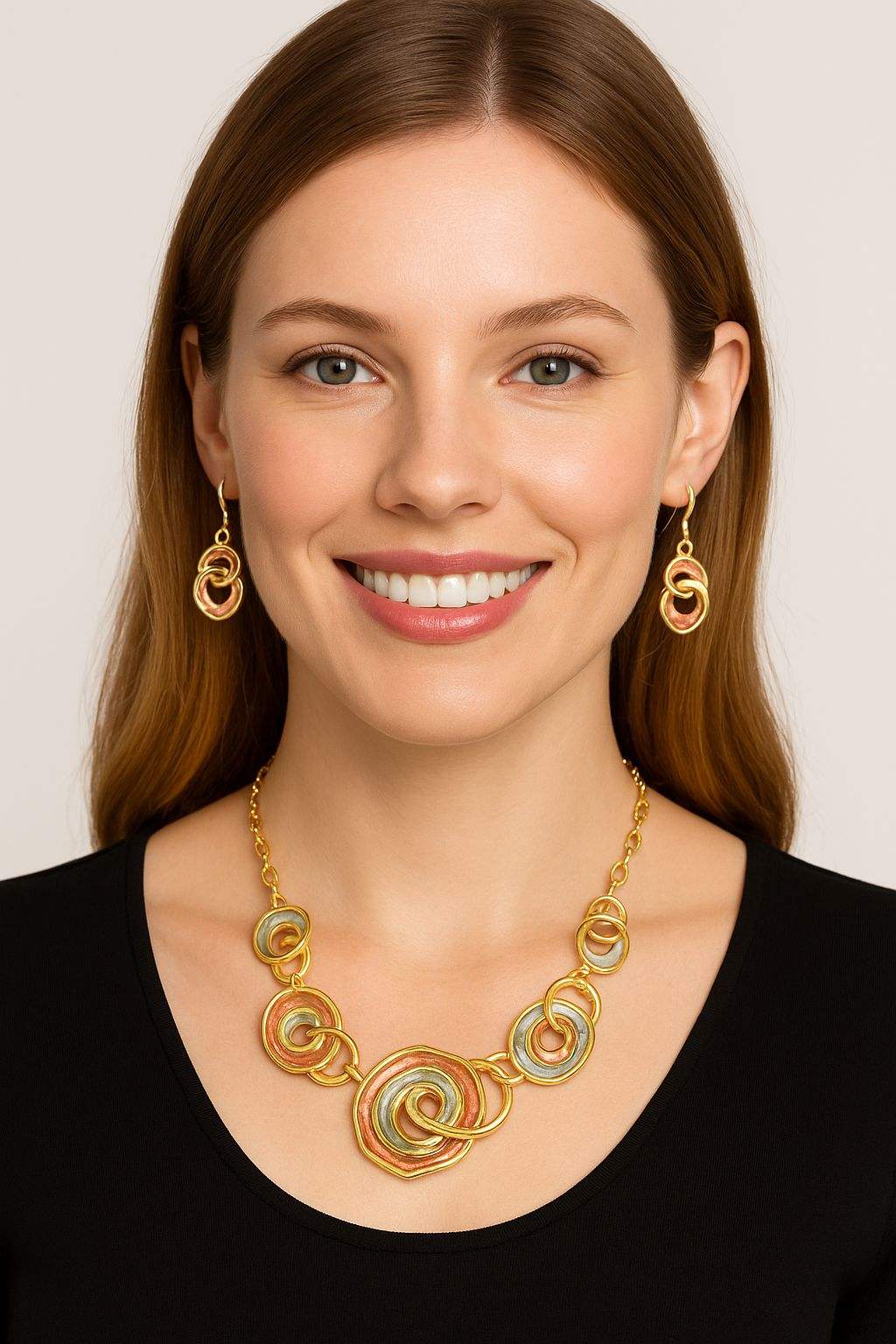 Elegant women's gold necklace and earrings set with spiral design, perfect for fashion and special occasions