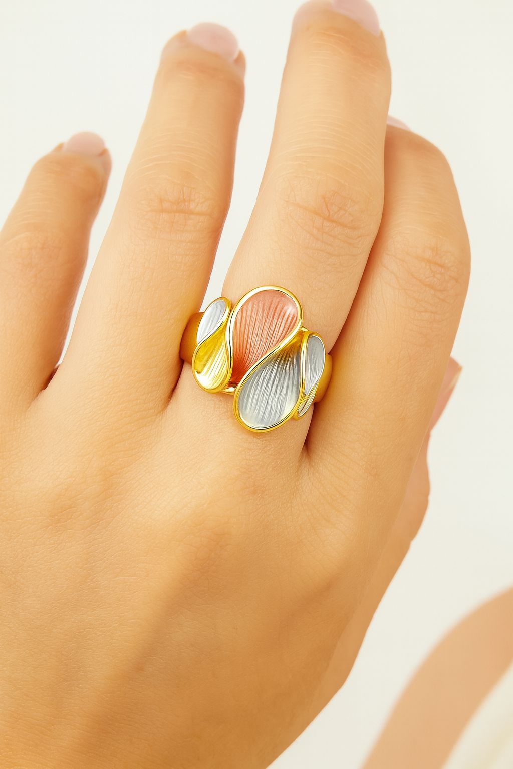 Side view of artistic petal-shaped enamel ring for women