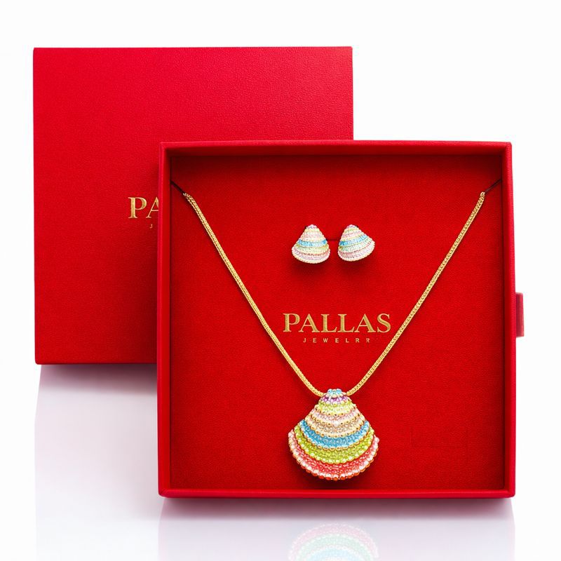 KC gold plated enamel necklace and earrings set presented in luxury gift box
