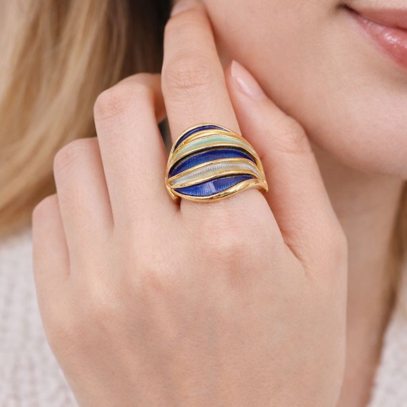 gold plated enamel ring worn on hand