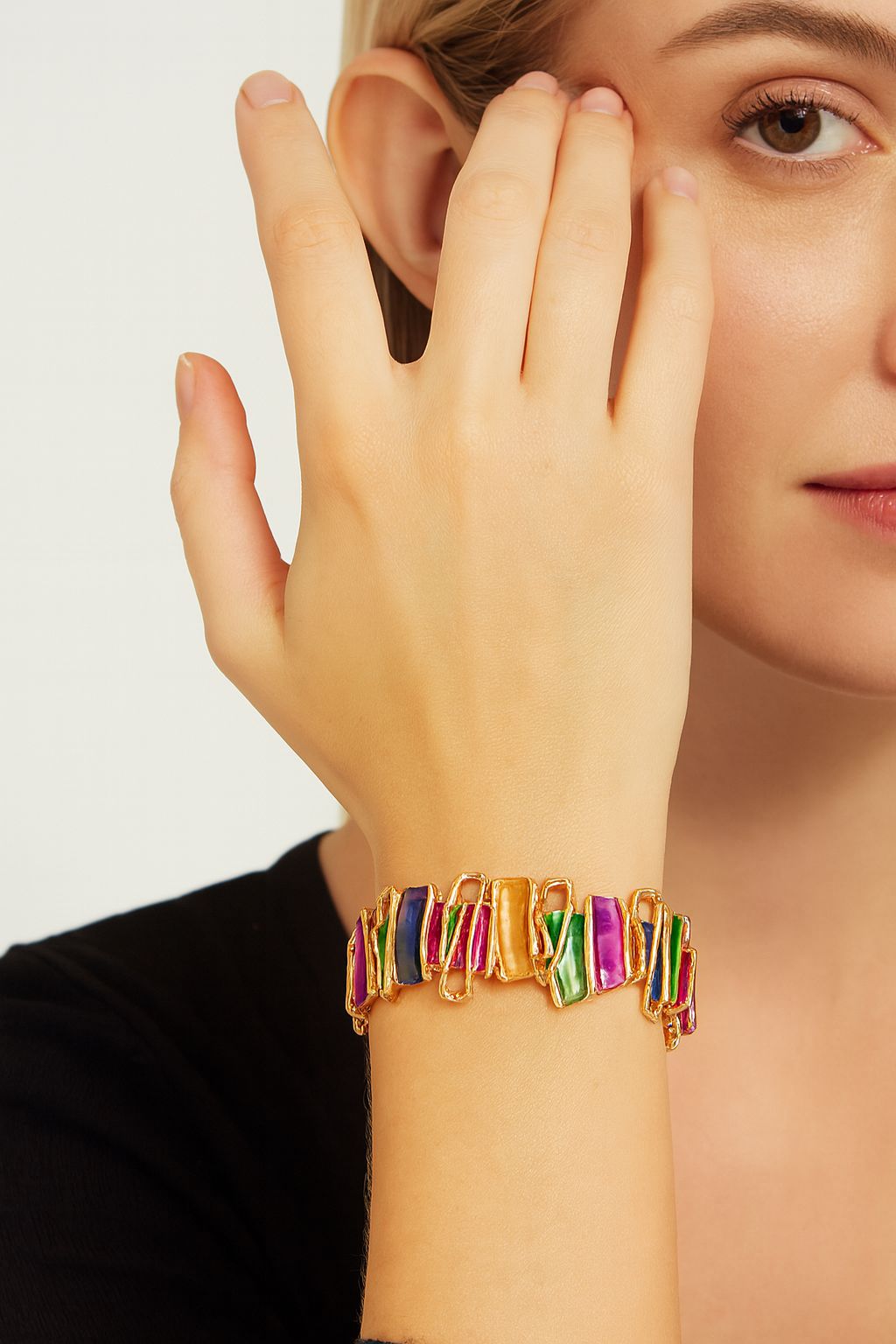 Detail view of gold-plated enamel fashion bracelet
