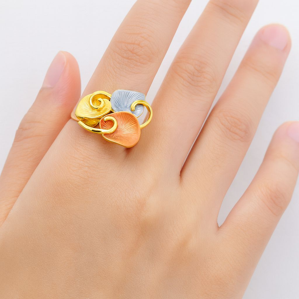 Adjustable KC gold enamel spiral ring worn on hand