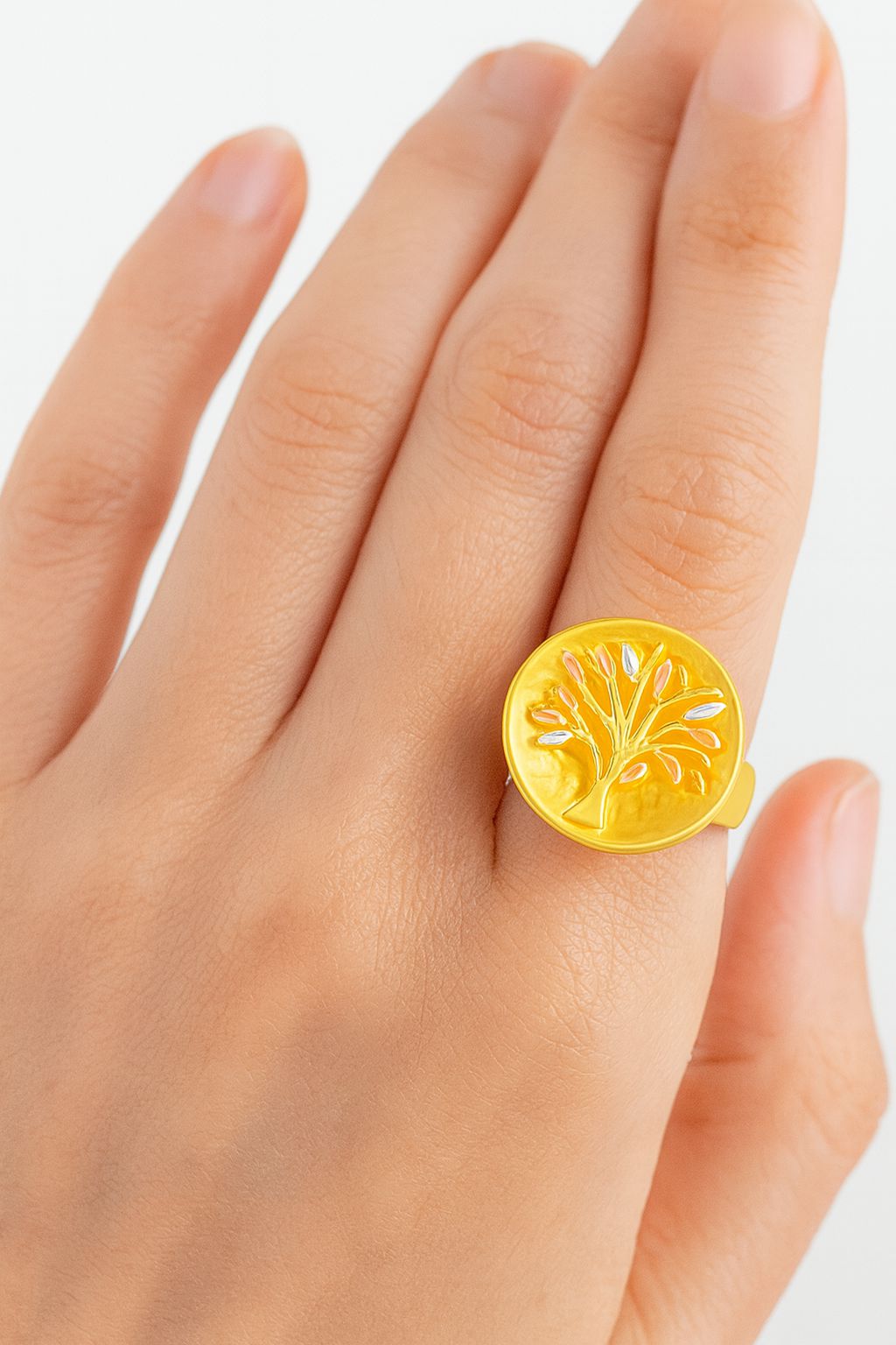 Round Tree of Life medallion ring in KC gold worn by woman
