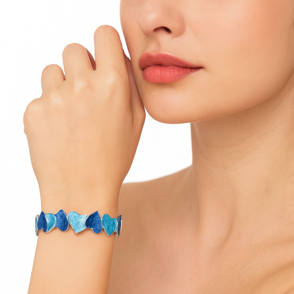 Gradient blue enamel heart bracelet close-up shot