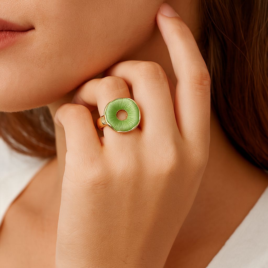 Modern green enamel ring worn on finger with KC gold plated alloy design