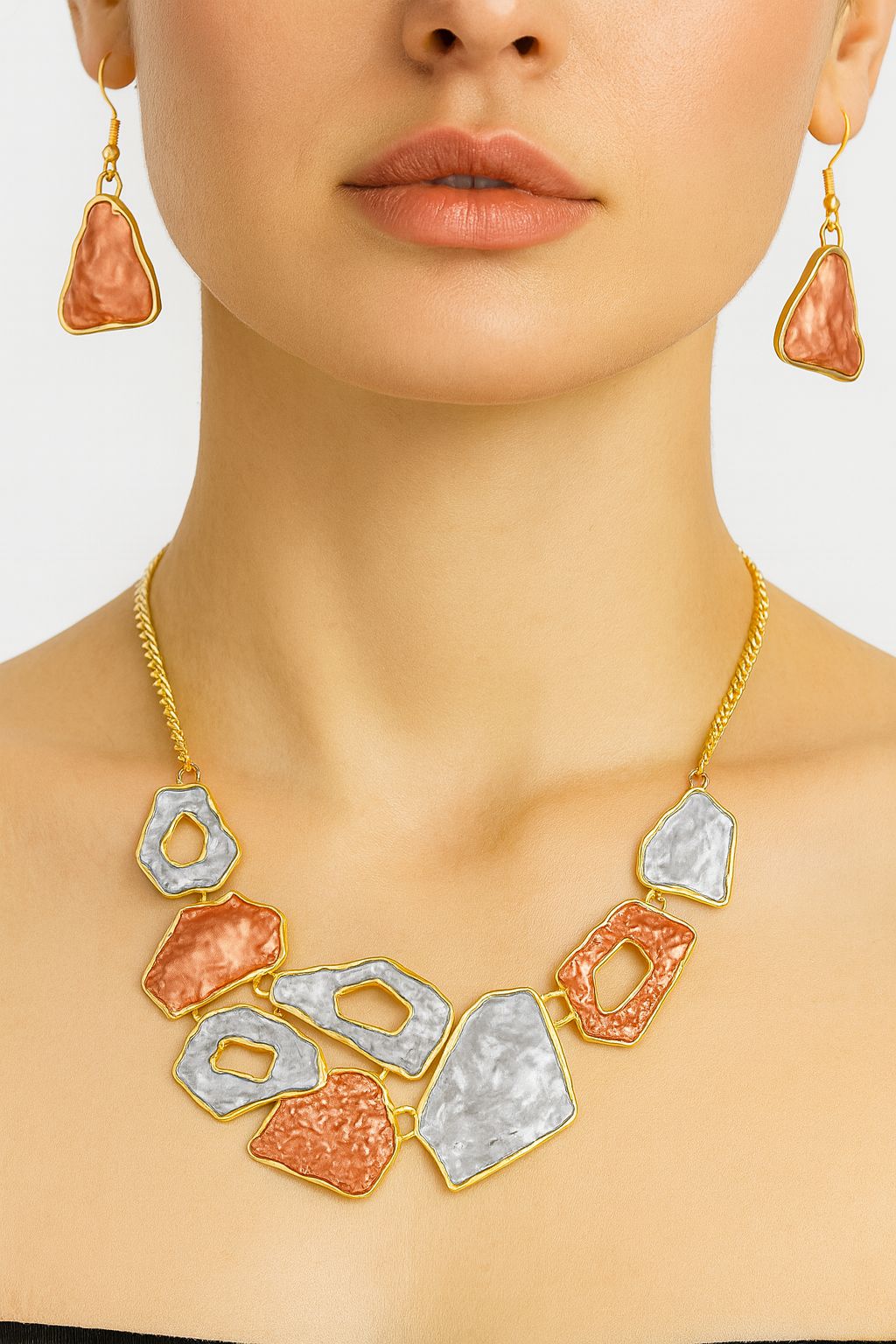 Hand-painted statement necklace and earrings showcased on model