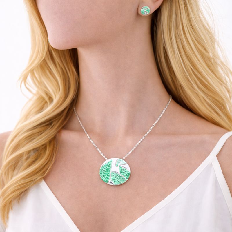 Close-up of hand-painted enamel texture on gold plated alloy jewelry