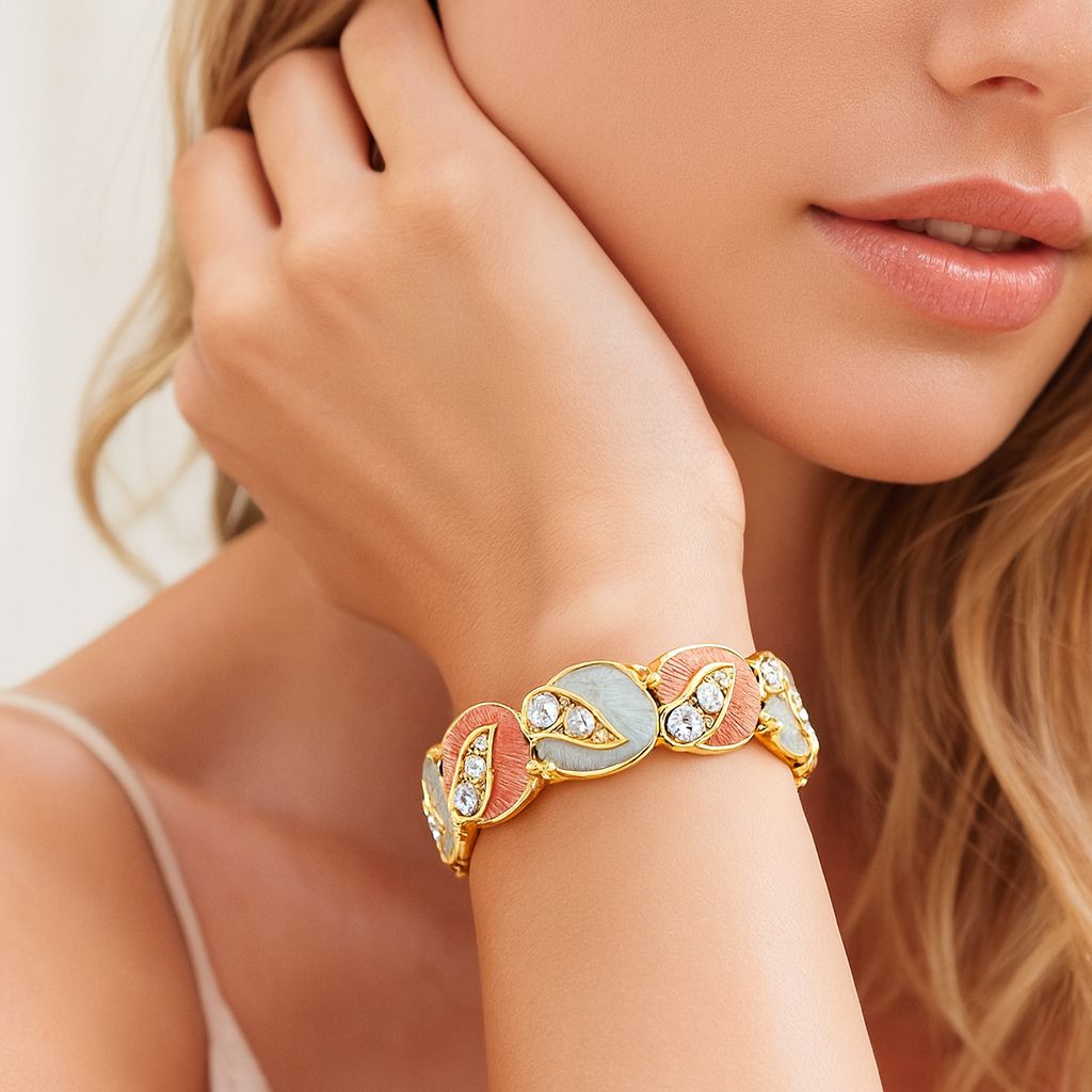 Artistic gold bracelet with crystal accents and enamel texture