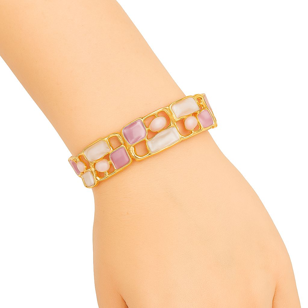 Close-up detail of hand-painted enamel gold bracelet