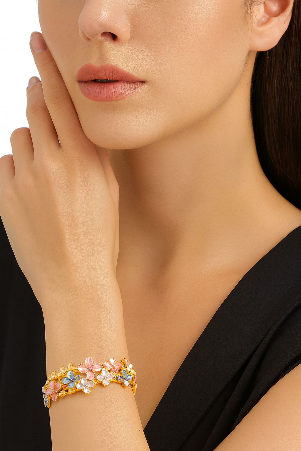 Woman wearing hand-painted enamel floral bracelet, elegant KC gold fashion accessory