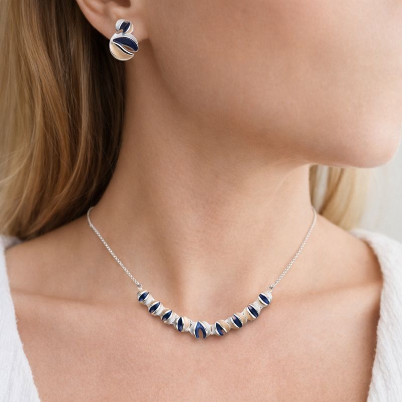 Hand painted enamel stud earrings with KC gold plating on model