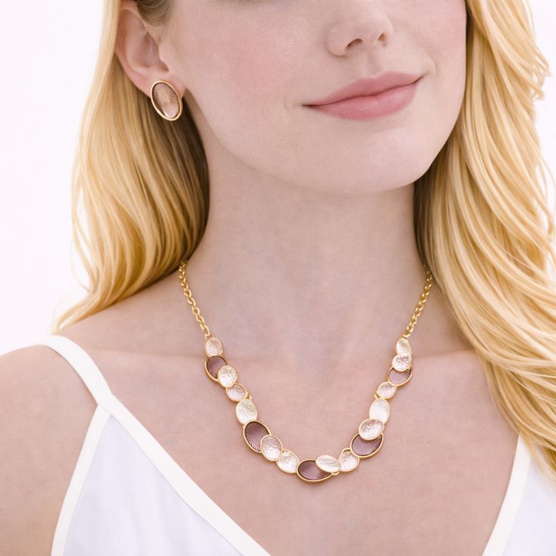 Close-up of hand-painted enamel detail on KC gold jewelry