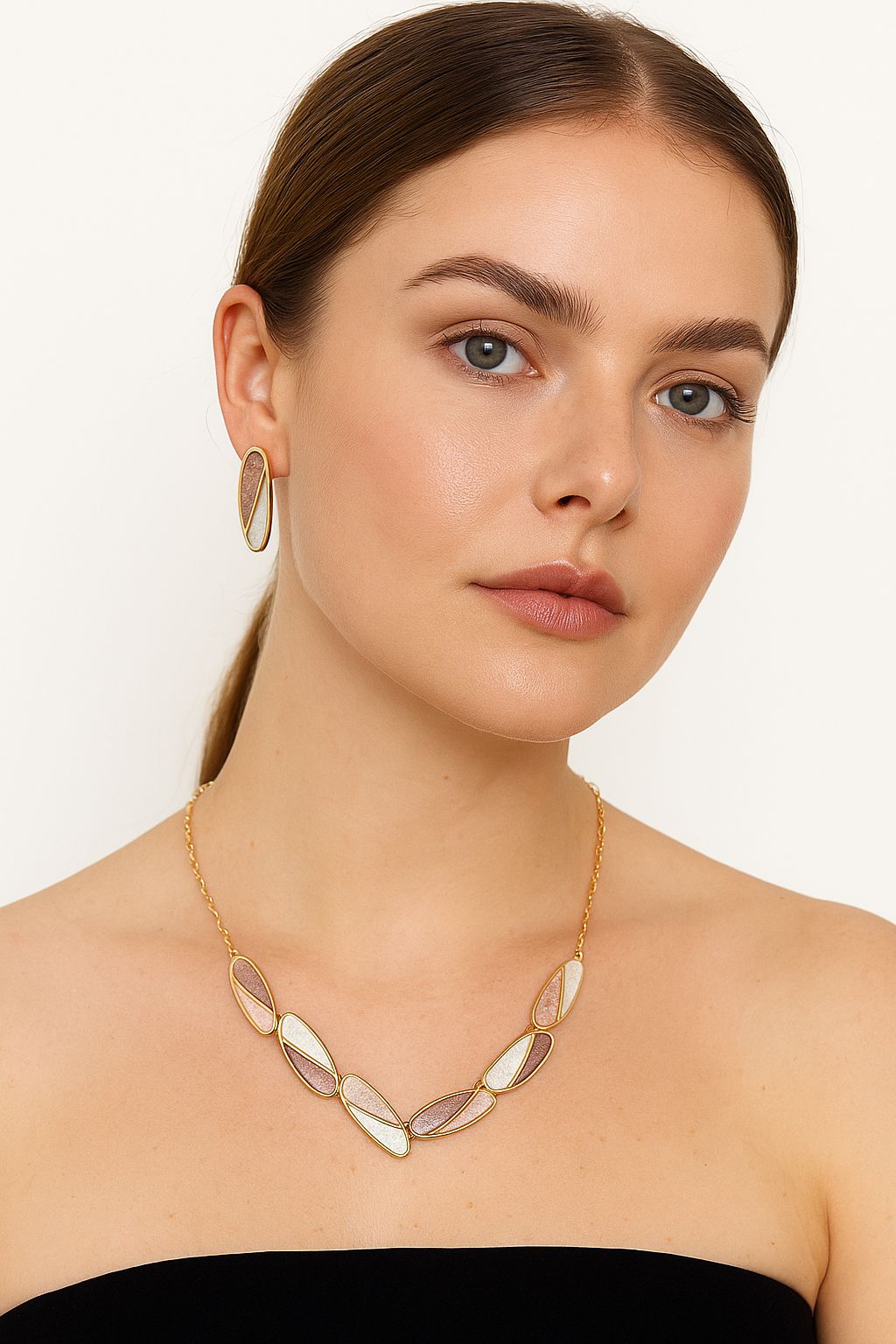 Model wearing KC gold plated hand-painted enamel necklace and earrings set