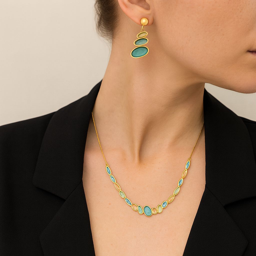 Hand-painted enamel necklace and earrings worn by model