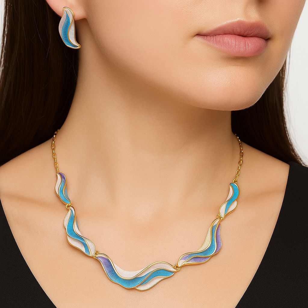 KC gold plated enamel earrings with flowing wave shape worn on model