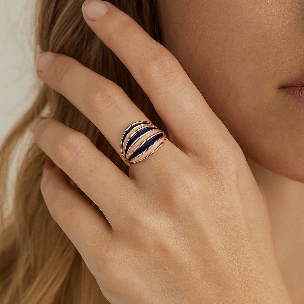 Hand painted wide enamel ring worn on finger with gold plated finish