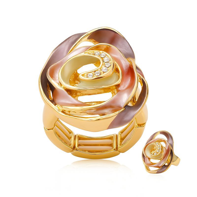 Hand-painted enamel spiral ring with KC gold plating on white background