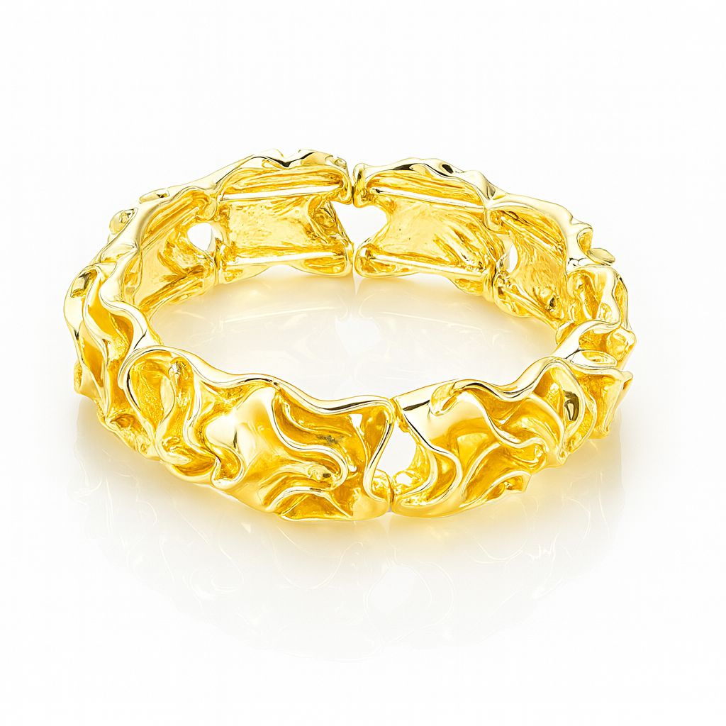 Sculptural gold bracelet with artistic wave design”