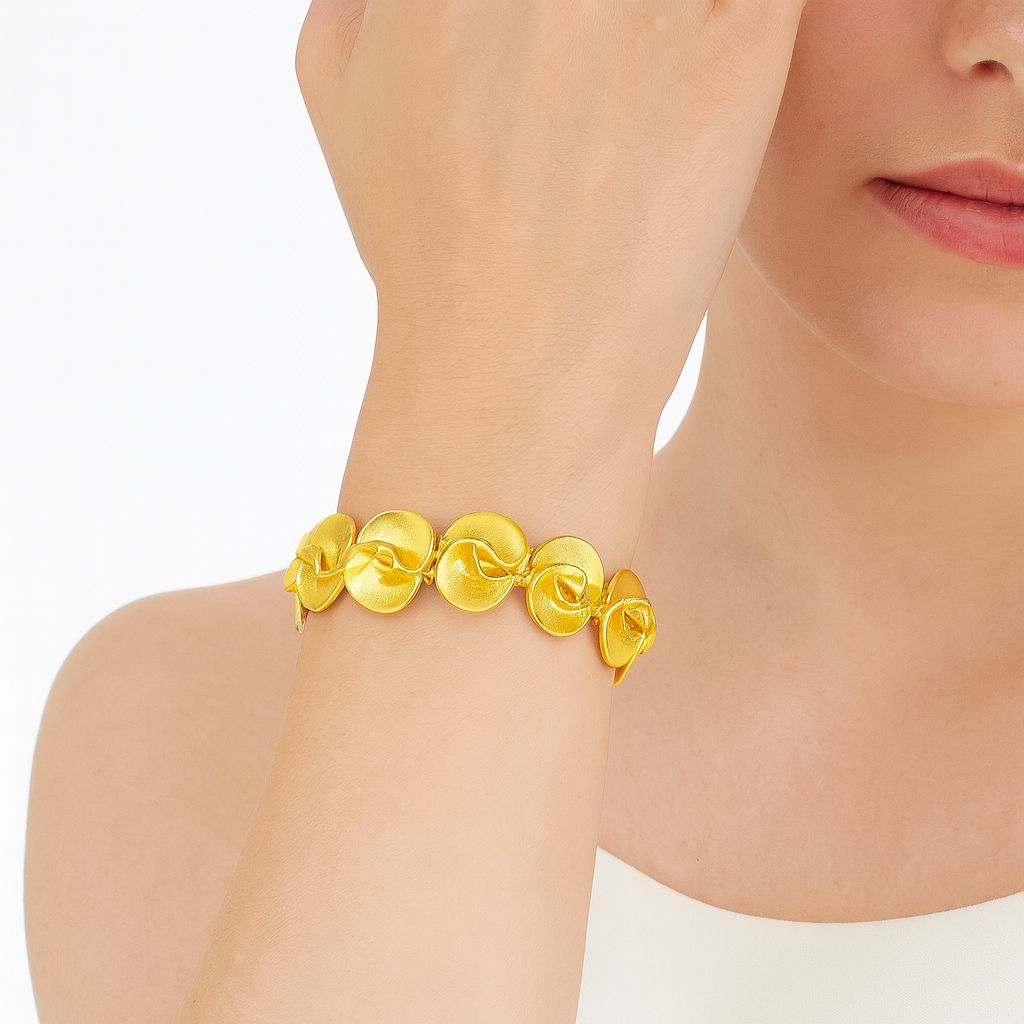 KC gold statement floral bangle with sculpted petal design