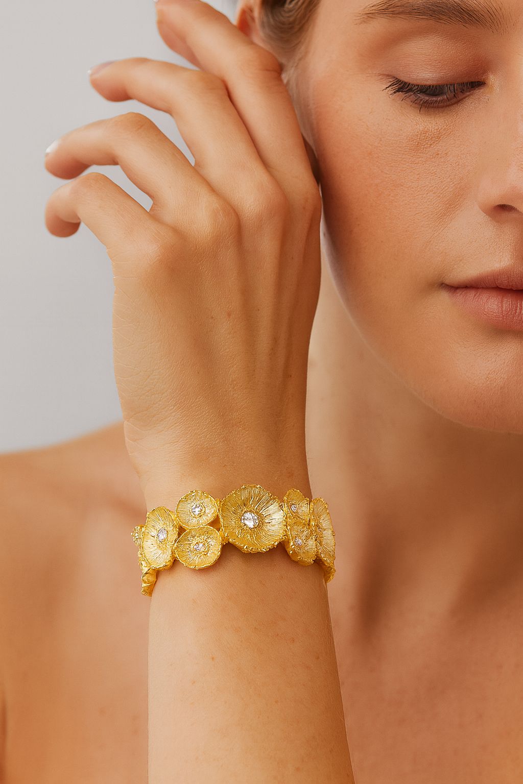 Hand-painted gold flower bracelet with crystals on wrist, KC gold plated floral bangle, elegant stretch fit accessory