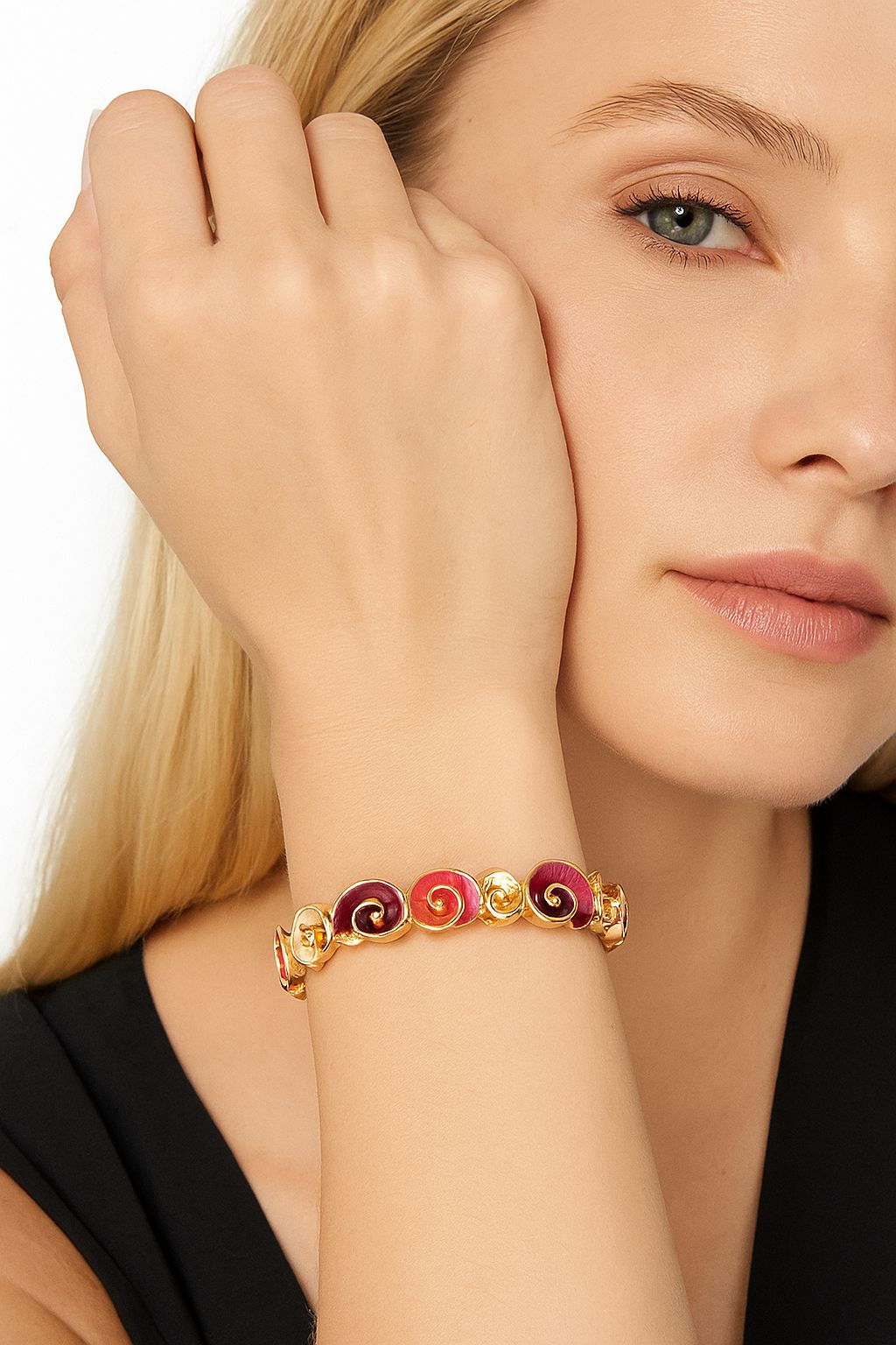 Model wearing colorful spiral gold bracelet in hand-painted finish.