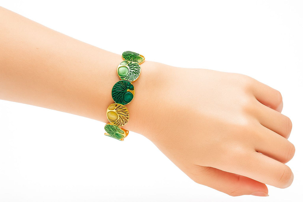 Close-up of hand-painted green enamel leaf bangle
