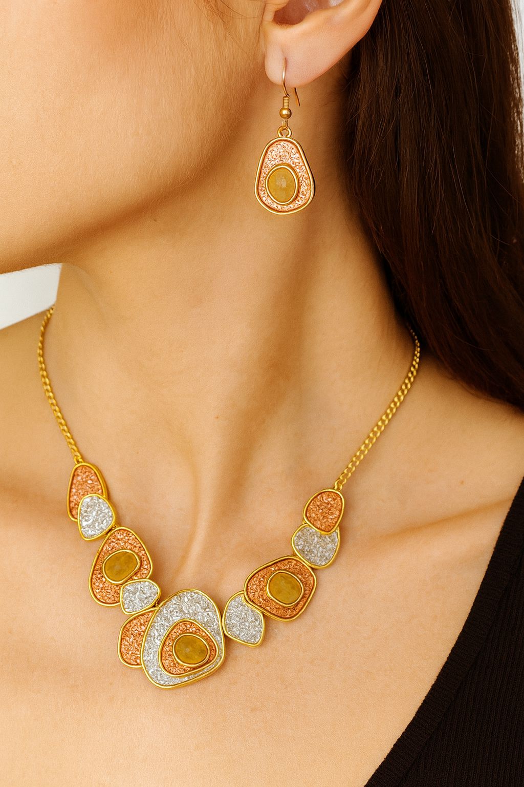 Close-up of colorful geometric necklace with matching earrings