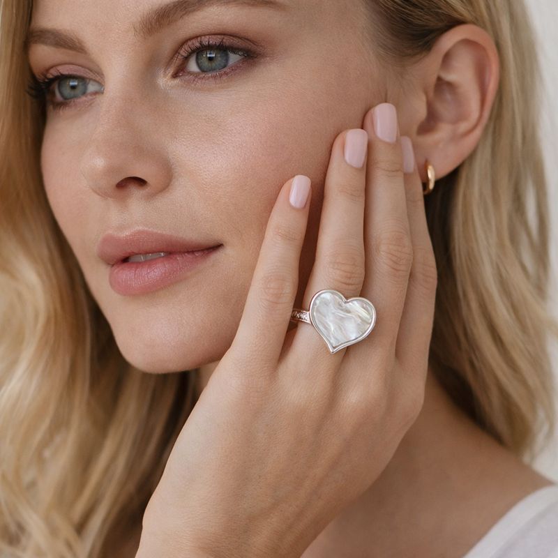 Hand painted white enamel heart silver ring worn on hand