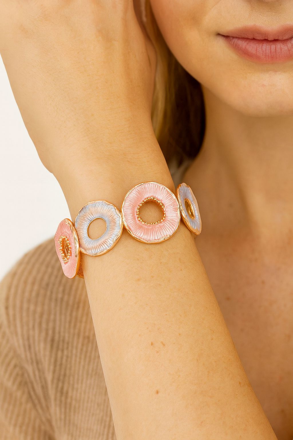 Close-up of hand-painted enamel circular bracelet links