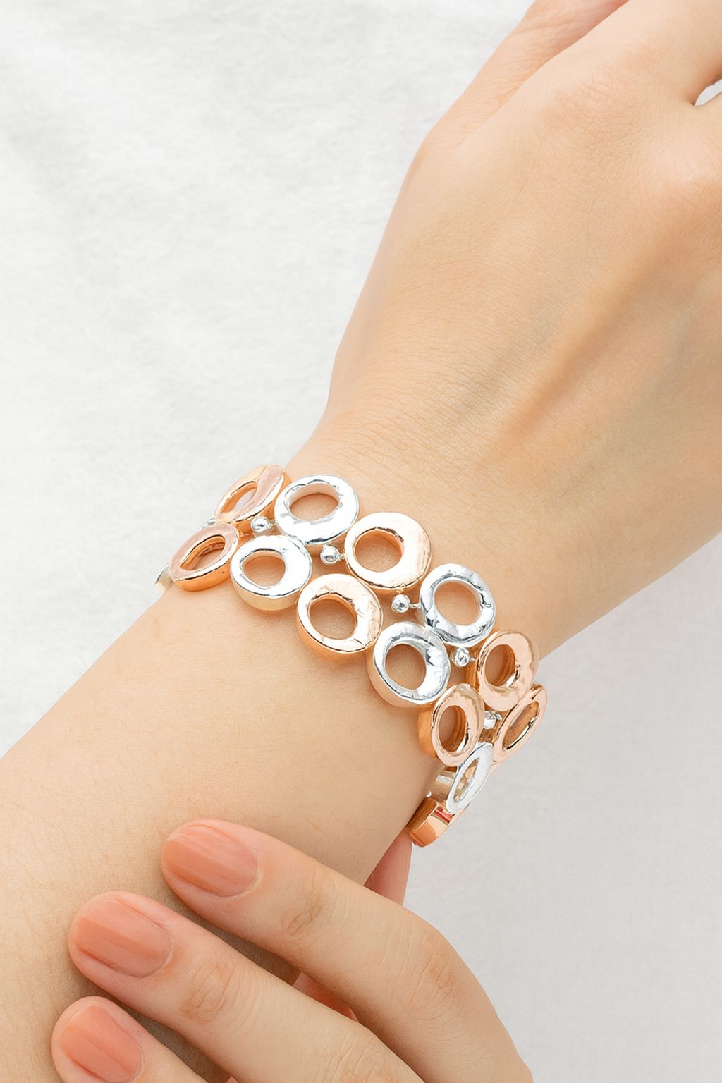 Model showing handmade openwork bracelet in gold plated alloy