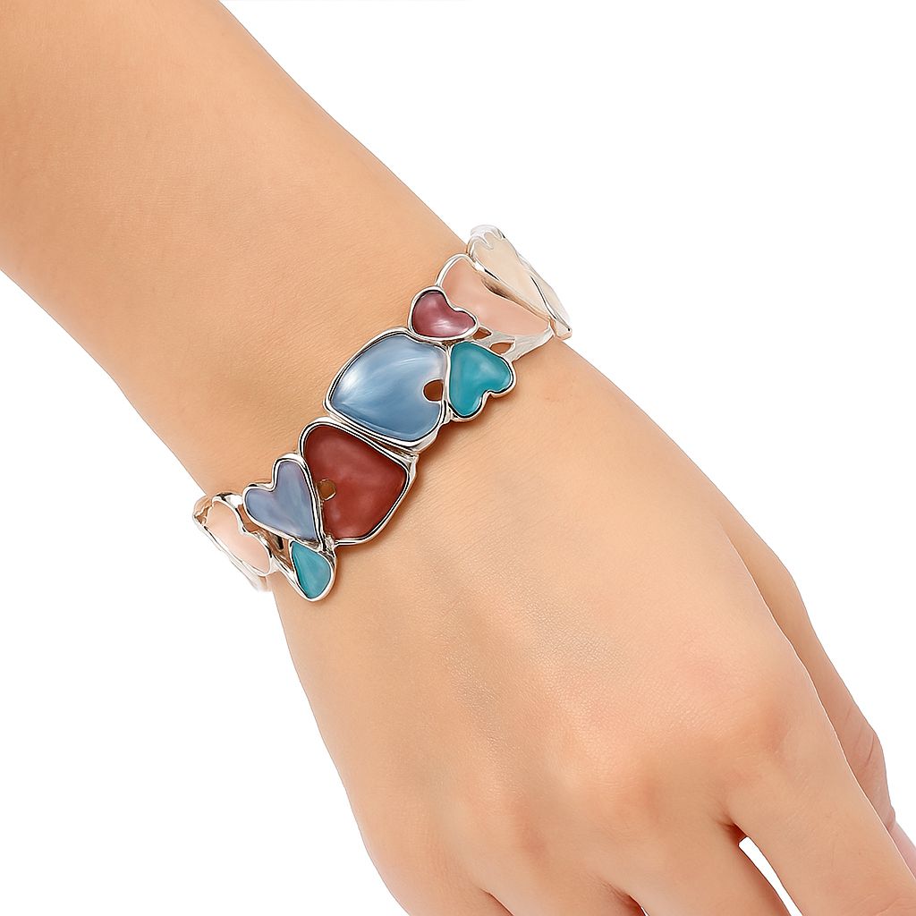 Woman wearing colorful enamel heart bracelet set, romantic jewelry look”