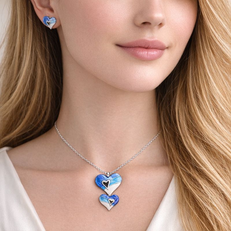 Heart shaped KC gold plated necklace and earrings worn by model