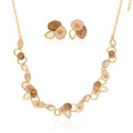 KC gold plated necklace and earrings set on white background