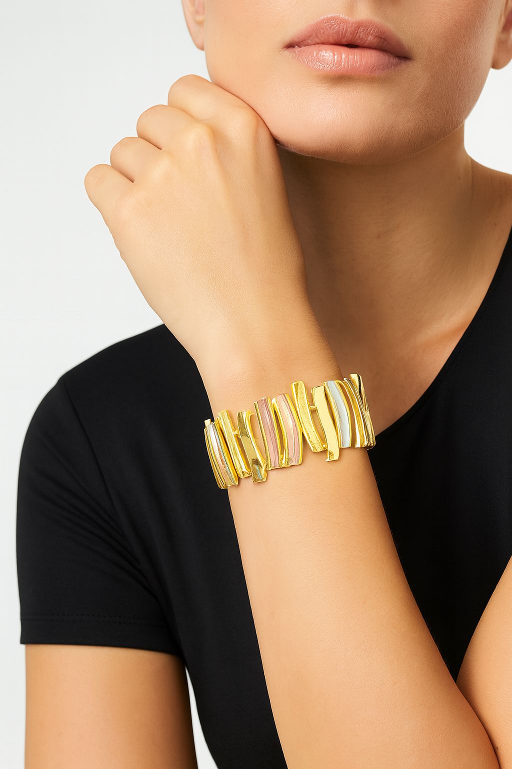 Artistic gold plated bracelet with textured abstract accents