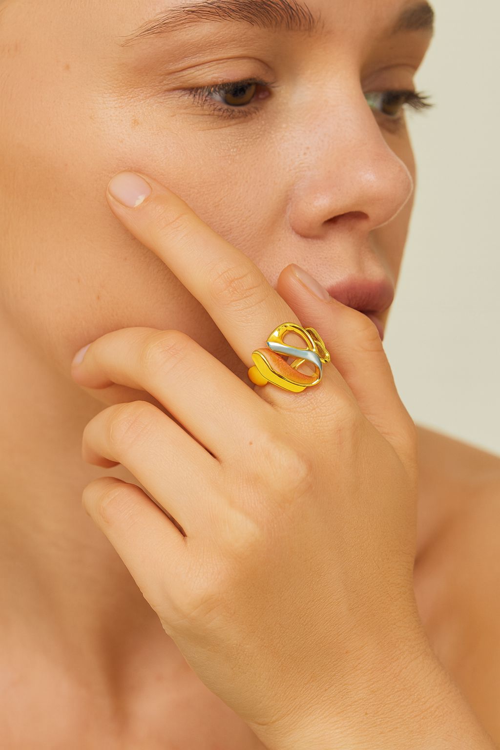 Artistic KC gold plated ring with abstract enamel design side angle