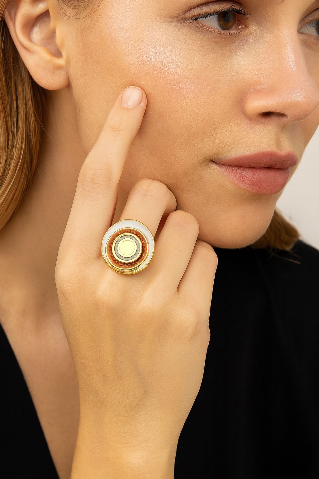 Model wearing colorful KC gold plated enamel statement ring